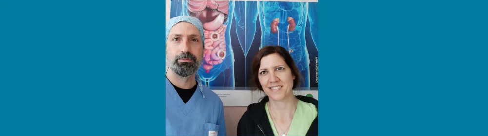 Man and woman stood in front of medical pictures